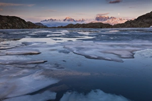 Brenta Dolomites at sunset seen from the Black Lake during the thaw, Adamello-Brenta Brenta Dolomites at sunset seen from the Black Lake during the thaw, Adamello-Brenta