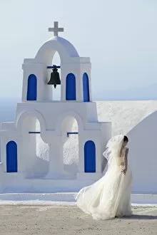 Images Dated 22nd July 2013: Bride walking past church, Santorini, Kyclades, South Aegean, Greece, Europe