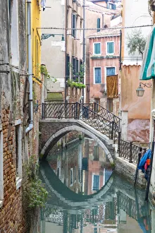 A bridge crosses a small canal, Castello, Venice; veneto; Italy A bridge crosses a small canal, Castello, Venice; veneto; Italy