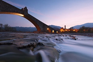 The bridge Gobbo of Bobbio at dusk, Piacenza district, Italy The bridge Gobbo of Bobbio at dusk, Piacenza district, Italy