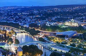 Bridge of Peace and the Mtkvari river. On the right, the Rike Park Music Theatre Bridge of Peace and the Mtkvari river. On the right, the Rike Park Music Theatre
