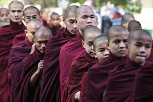 Buddhist monks lining up for lunch at Mahagandayon Monastery, largest Buddhist monastery Buddhist monks lining up for lunch at Mahagandayon Monastery, largest Buddhist monastery