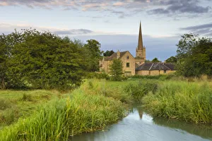 Burford Mill and Church viewed from the River Windrush in the water meadows, Burford Burford Mill and Church viewed from the River Windrush in the water meadows, Burford