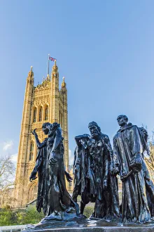 The Burghers of Calais statue by Auguste Rodin, and the Palace of Westminster a UNESCO The Burghers of Calais statue by Auguste Rodin, and the Palace of Westminster a UNESCO