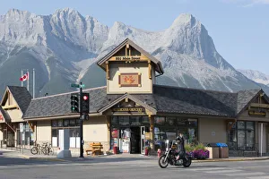 Canada, Alberta, Canmore, biker on main street Canada, Alberta, Canmore, biker on main street