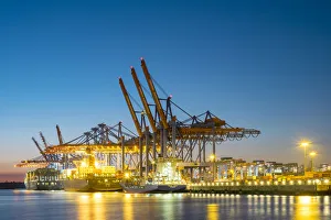 Cargo ships being loaded at Burchardkai in Hamburg Harbor at night, Waltershofer Hafen Cargo ships being loaded at Burchardkai in Hamburg Harbor at night, Waltershofer Hafen