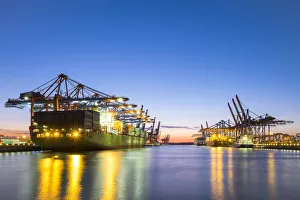Cargo ships being loaded at Eurokai and Burchardkai in Hamburg Harbor at night, Waltershofer Cargo ships being loaded at Eurokai and Burchardkai in Hamburg Harbor at night, Waltershofer