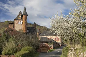 Castel de Maussac with blossom, Collonges-la-Rouge, Correze, Nouvelle-Aquitaine, France Castel de Maussac with blossom, Collonges-la-Rouge, Correze, Nouvelle-Aquitaine, France