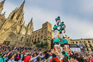 Castellers or Human Tower exhibiting in front of the Cathedral, Barcelona, Catalonia Castellers or Human Tower exhibiting in front of the Cathedral, Barcelona, Catalonia