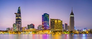 Central Ho Chi Minh City (Saigon) skyline and Saigon River at dusk, Vietnam Central Ho Chi Minh City (Saigon) skyline and Saigon River at dusk, Vietnam
