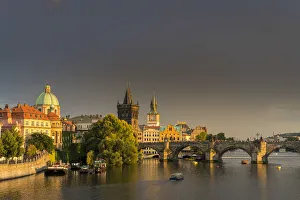 Charles Bridge and Church of Saint Francis of Assisi with Old Town Bridge Tower against Charles Bridge and Church of Saint Francis of Assisi with Old Town Bridge Tower against