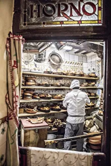 A chef roasting pork at traditional Spanish restaurant, Botin, Madrid, Spain A chef roasting pork at traditional Spanish restaurant, Botin, Madrid, Spain
