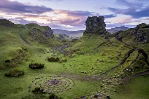 Circular rock pattern on green landscape near Castle Ewen at sunset, Fairy Glen, Isle Circular rock pattern on green landscape near Castle Ewen at sunset, Fairy Glen, Isle