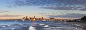 Nautical Theme Gallery: City skyline & Waitemata Harbour illuminated at sunset, Auckland, North Island, New Zealand