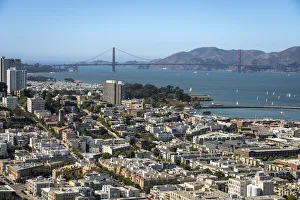 Cityscape near famous Golden Gate Bridge against blue sky on sunny day, San Francisco Cityscape near famous Golden Gate Bridge against blue sky on sunny day, San Francisco