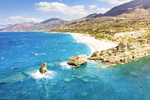 cliffs and Triopetra beach washed by the crystal turquoise sea, Plakias, Crete island cliffs and Triopetra beach washed by the crystal turquoise sea, Plakias, Crete island