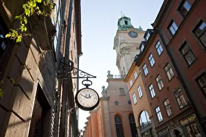 Clock outside shop & The clocktower of Storkyrkan (The Great Church), Gamla Stan Clock outside shop & The clocktower of Storkyrkan (The Great Church), Gamla Stan