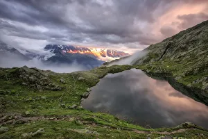 Clouds are tinged with purple at sunset at Lac de Cheserys Chamonix Haute Savoie Clouds are tinged with purple at sunset at Lac de Cheserys Chamonix Haute Savoie