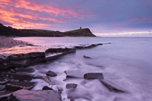 Colourful dawn sky above Kimmeridge Bay on the Jurassic Coast, Dorset, England. Winter Colourful dawn sky above Kimmeridge Bay on the Jurassic Coast, Dorset, England. Winter