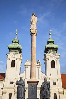 Column of the Virgin Mary and St Ignatius Church in Szechenyi Square, Gyor, Western Column of the Virgin Mary and St Ignatius Church in Szechenyi Square, Gyor, Western