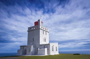Sudurland Region Gallery: Concrete Dyrholaey Lighthouse against cloudy sky at Dyrholaey, South Iceland, Iceland