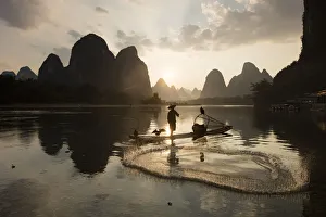 Cormorant fisherman on Li River, Guangxi Yangshuo, China Cormorant fisherman on Li River, Guangxi Yangshuo, China