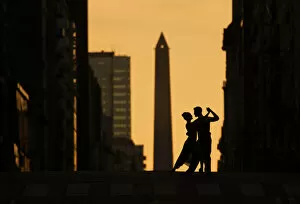 Arts Collection: A couple of Professional Tango dancers on Avenida Corrientes at sunset