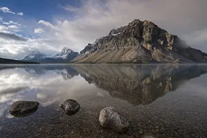 Crowfoot mountain reflection in the mirror still waters of Bow Lake, Banff National Park Crowfoot mountain reflection in the mirror still waters of Bow Lake, Banff National Park