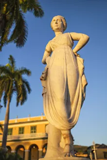 Cuba, Trinidad, Statue of the Greek muse Terpsicore at Plaza Mayor with Brunet Palace Cuba, Trinidad, Statue of the Greek muse Terpsicore at Plaza Mayor with Brunet Palace