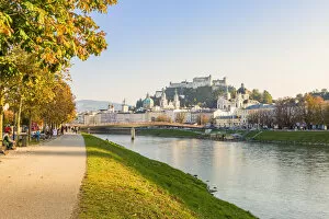 Cycle path along Salzach river with the old town in the background, Salzburg