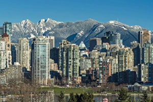Downtown skyline with snowy mountains behind, Vancouver, British Columbia, Canada Downtown skyline with snowy mountains behind, Vancouver, British Columbia, Canada