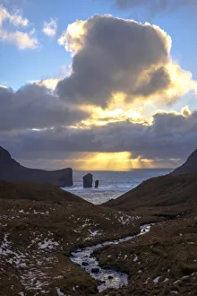 Drangarnir sea stacks at sunset. Faroe Islands Drangarnir sea stacks at sunset. Faroe Islands