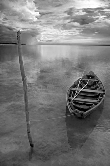 Dug out canoe used by local fishermen pulled up on Dug out canoe used by local fishermen pulled up on