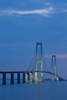 Dusk over the illuminated East Bridge as seen from Korsor, Denmark Dusk over the illuminated East Bridge as seen from Korsor, Denmark