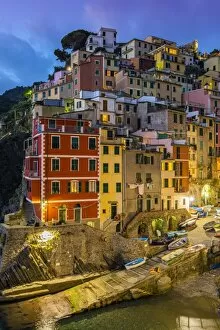 Images Dated 26th October 2014: Dusk view of the colorful sea village of Riomaggiore, Cinque Terre, Liguria, Italy