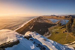 Dyrholaey headland, Vik i Myrdal, Southern Iceland, Iceland. Reynisfjara beach at dusk Dyrholaey headland, Vik i Myrdal, Southern Iceland, Iceland. Reynisfjara beach at dusk
