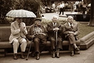Images Dated 28th October 2007: Ecuador, Quito. Four old men discuss events in a park in the Plaza de Armas
