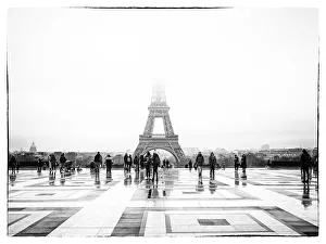 The Eiffel Tower in the morning fog as seen from the observation deck at the Palais de The Eiffel Tower in the morning fog as seen from the observation deck at the Palais de