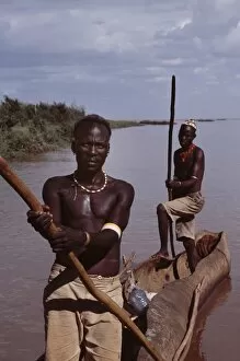 Lake Turkana National Parks Collection: El Molo fishermen in their dugout canoe on the fringe