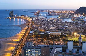 Elevated dusk view over Barcelona beaches and seaport, Barcelona, Catalunya, Spain Elevated dusk view over Barcelona beaches and seaport, Barcelona, Catalunya, Spain