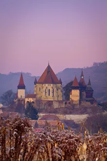 Elevated view towards Biertan fortified church at dusk, Biertan, nr Elevated view towards Biertan fortified church at dusk, Biertan, nr