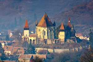 Elevated view over Biertan fortified church at sunrise, Biertan, nr Elevated view over Biertan fortified church at sunrise, Biertan, nr