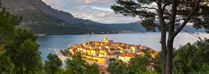 Elevated view over picturesque Korcula Town illuminated at sunset, Korcula, Dalmatia Elevated view over picturesque Korcula Town illuminated at sunset, Korcula, Dalmatia