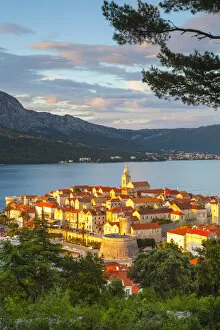 Images Dated 26th August 2014: Elevated view over picturesque Korcula Town illuminated at sunset, Korcula, Dalmatia
