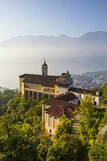 Doug Pearson Gallery: Elevated view over the picturesque Sanctuary of Madonna del Sasso illuminated at sunrise