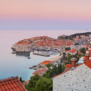 Elevated view over Stari Grad (Old Town) illuminated at sunrise, Dubrovnik, Dalmatia Elevated view over Stari Grad (Old Town) illuminated at sunrise, Dubrovnik, Dalmatia