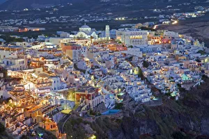 Elevated view over the Volcanic landscape and main town of Fira, Santorini (Thira) Elevated view over the Volcanic landscape and main town of Fira, Santorini (Thira)