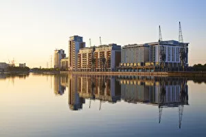 England, London, Hotels and appartment buildings reflecting in Royal Victoria Docks