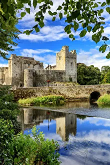 Europe, Ireland, Cahir castle and village at sunset reflecting in Caher river Europe, Ireland, Cahir castle and village at sunset reflecting in Caher river