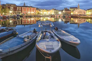Europe, Slovenia, Primorska, Izola. Old town and the harbour with fishing boats at dusk Europe, Slovenia, Primorska, Izola. Old town and the harbour with fishing boats at dusk
